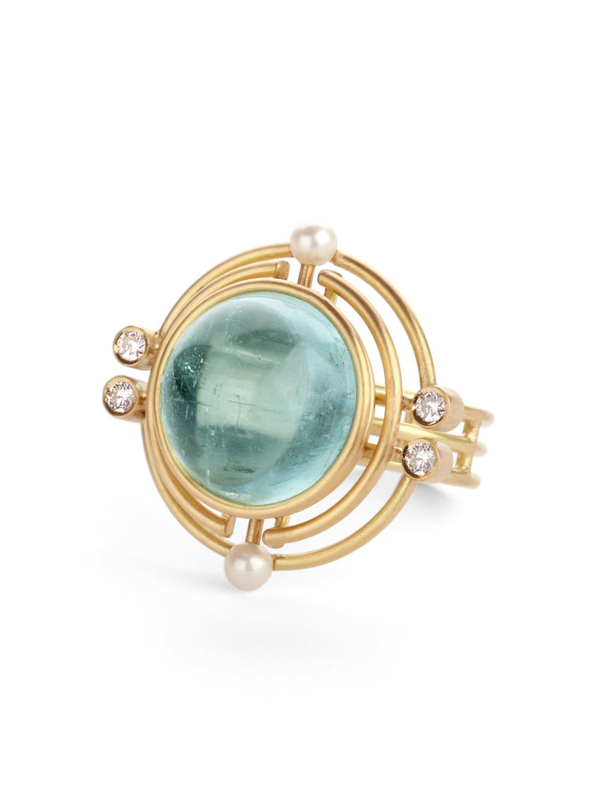 Aquamarine, pearl and diamond statement ring with concentric circular detail.