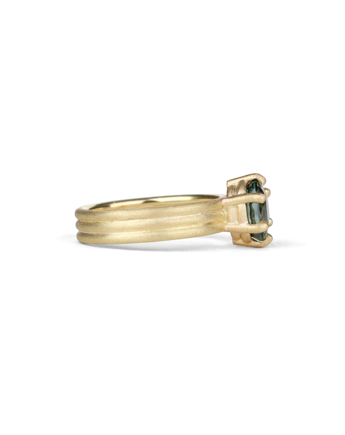 Oval green sapphire ring with six claw setting. On joined triple band, 18t yellow gold, textured finish. Side view.