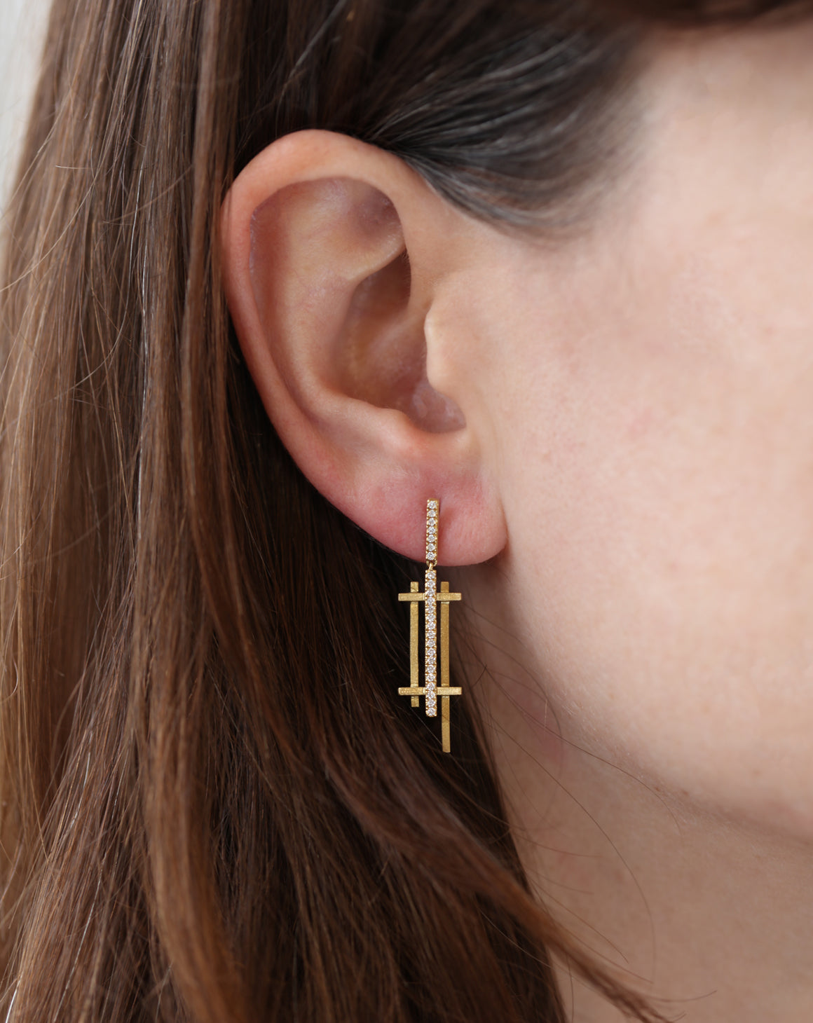 Geometric drop earrings with tiny diamond line detail. 18ct yellow gold, textured finish. Worn in ear.
