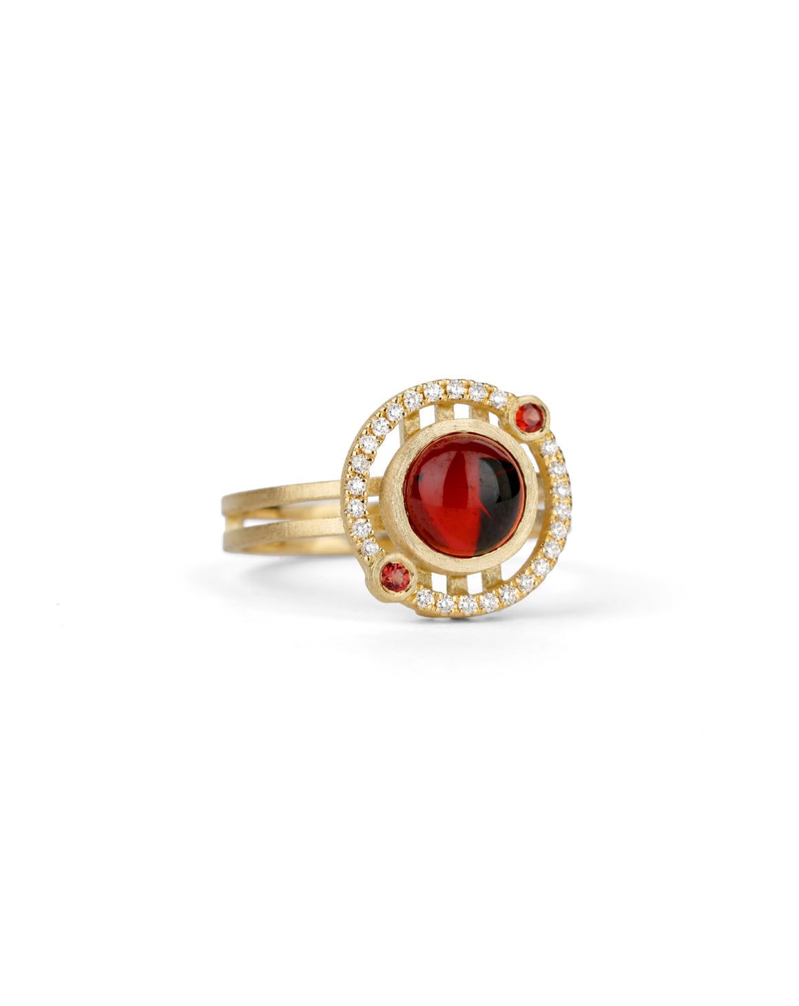 Geometric ring with red garnet and two orange sapphires and a diamond circular surround. 18ct yellow gold, textured finish.