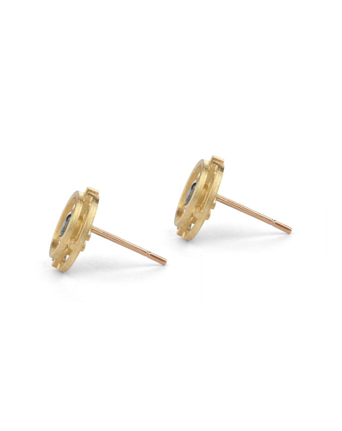 Geometric earrings with concentric circles and central teal sapphires. 18ct yellow gold, textured finish. Side view.