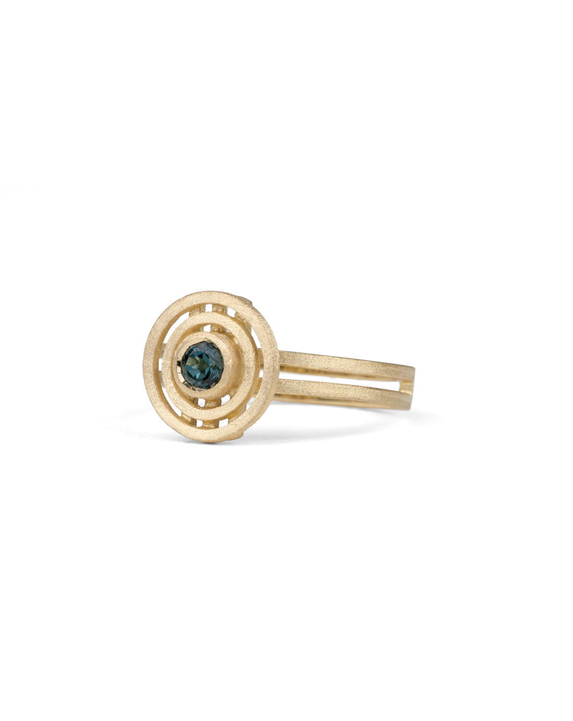 Geometric ring with concentric circles, central teal tourmaline. 18ct yellow gold, textured finish.