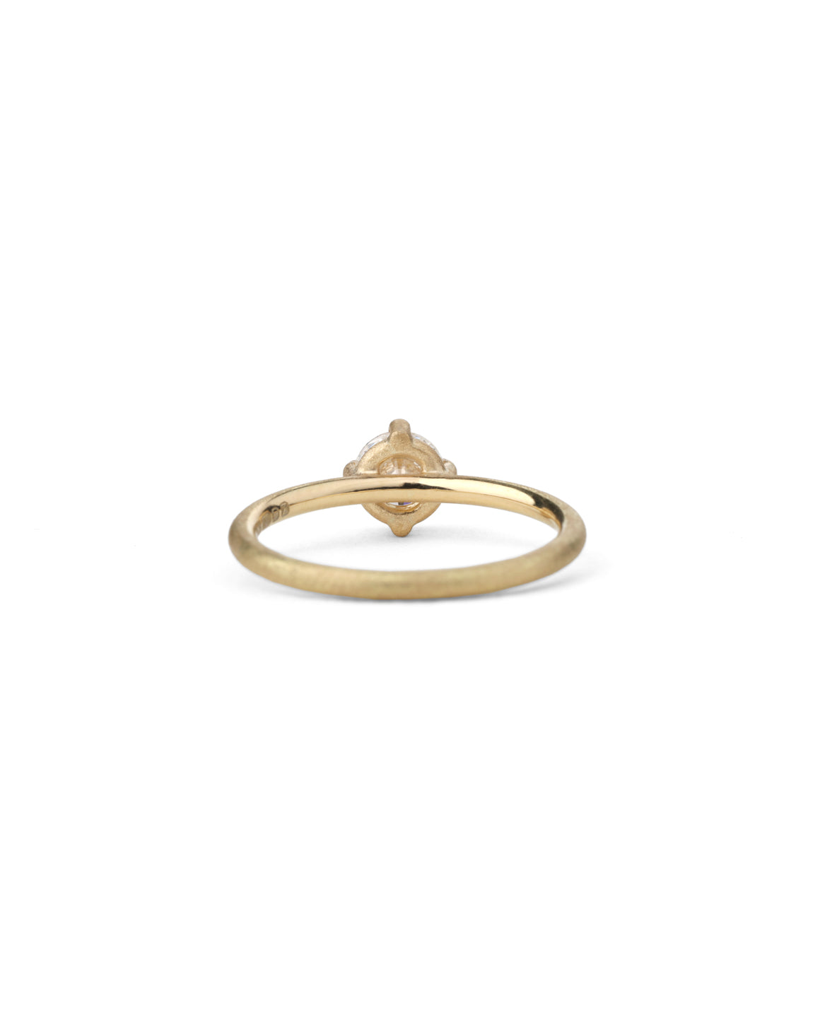 Solitaire ring with round white diamond, four claw setting. 18ct yellow gold, textured finish. Back view.