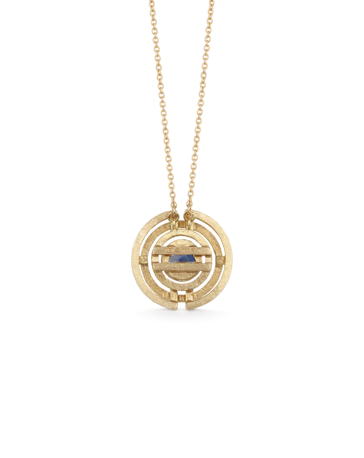 Geometrically patterned pendant featuring a central blue sapphire. Textured 18ct yellow gold. Back view.