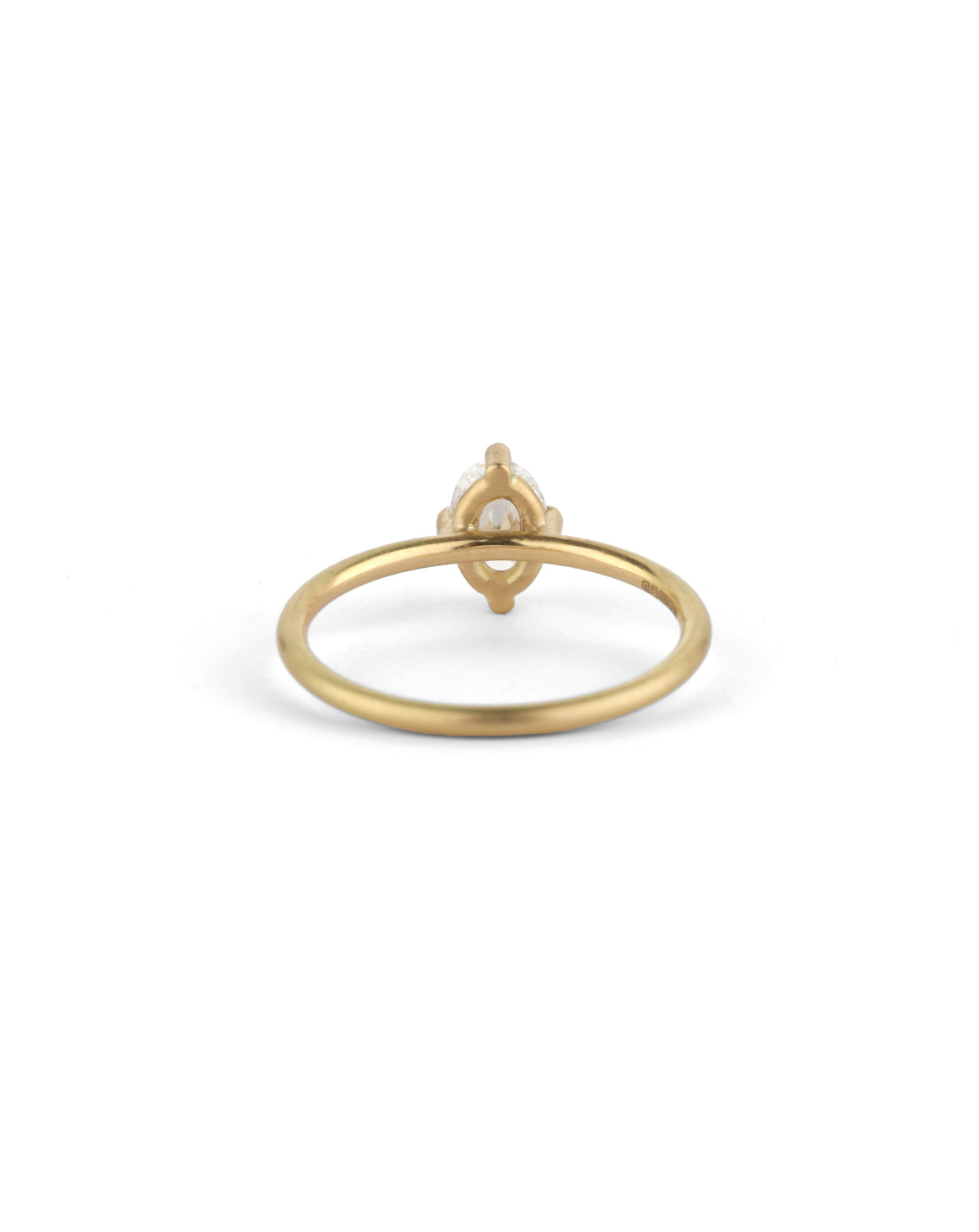 Solitaire ring with an oval white diamond. 18ct yellow gold, satin finish. Back view.