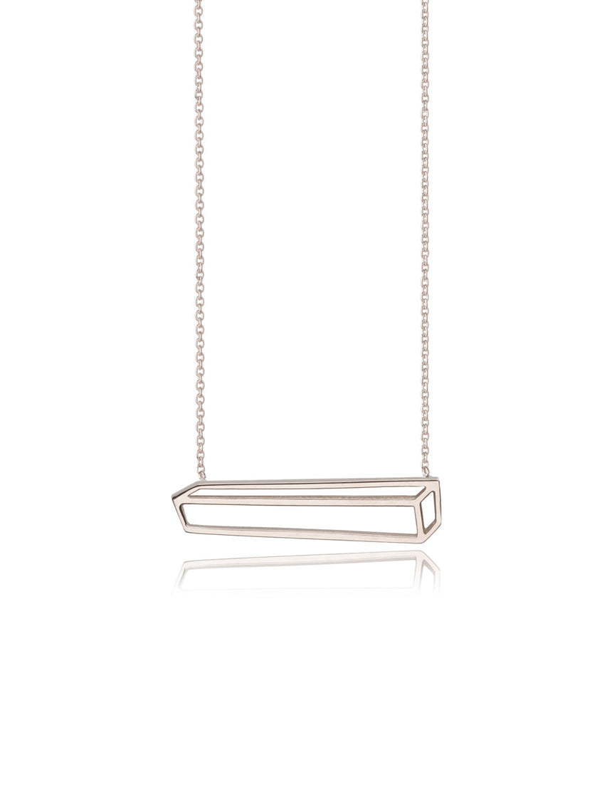 A pendant as a 2d representation of a long rectangular 3d cuboid. 18ct white gold, polished finish.