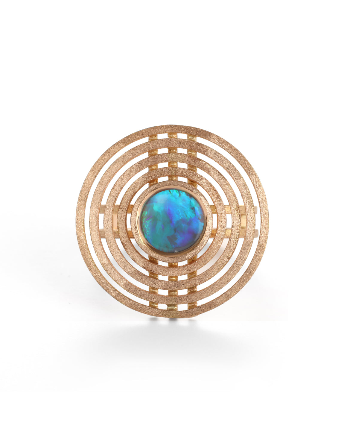 Geometric statement ring with a blue opal surrounded by circular detail. 18ct rose gold, textured finish.
