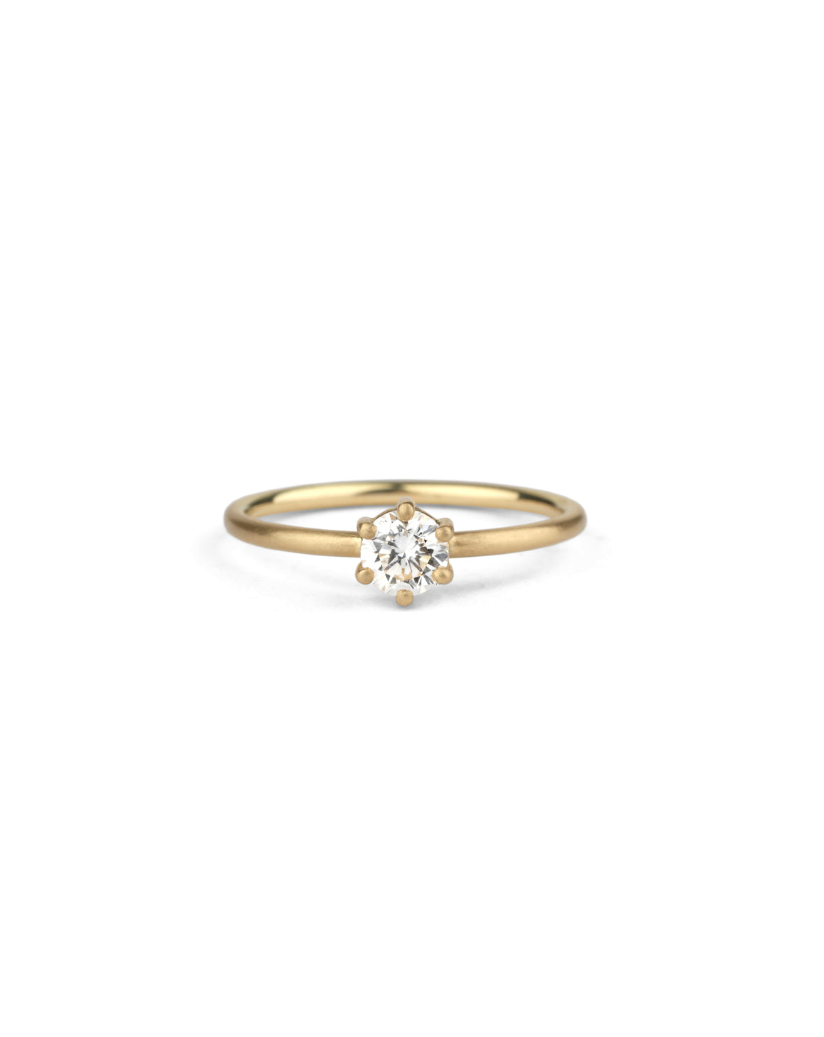 Solitaire ring with round white diamond, six claw setting. 18ct yellow gold, satin finish.