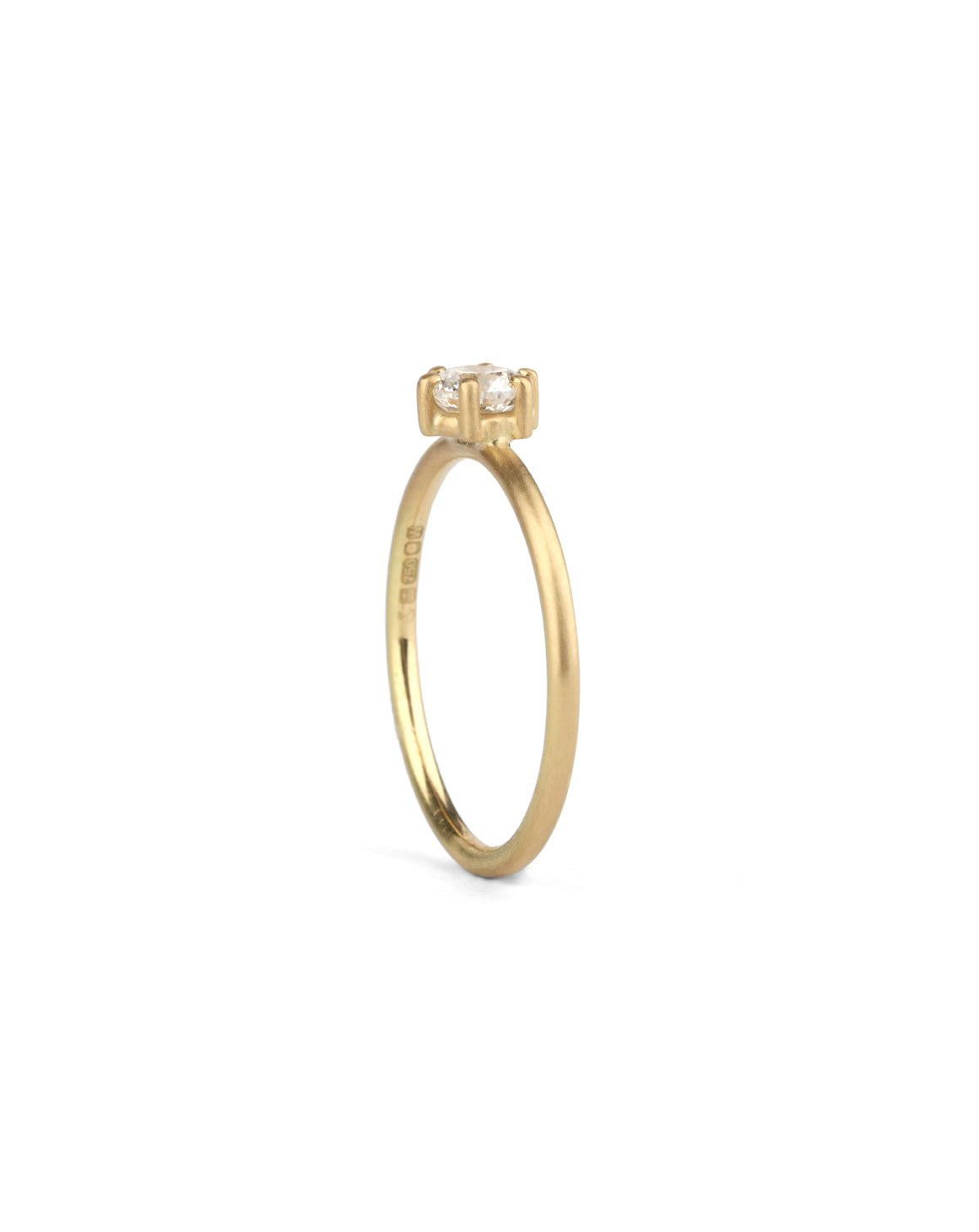 Solitaire ring with round white diamond, six claw setting. 18ct yellow gold, satin finish. Side view.