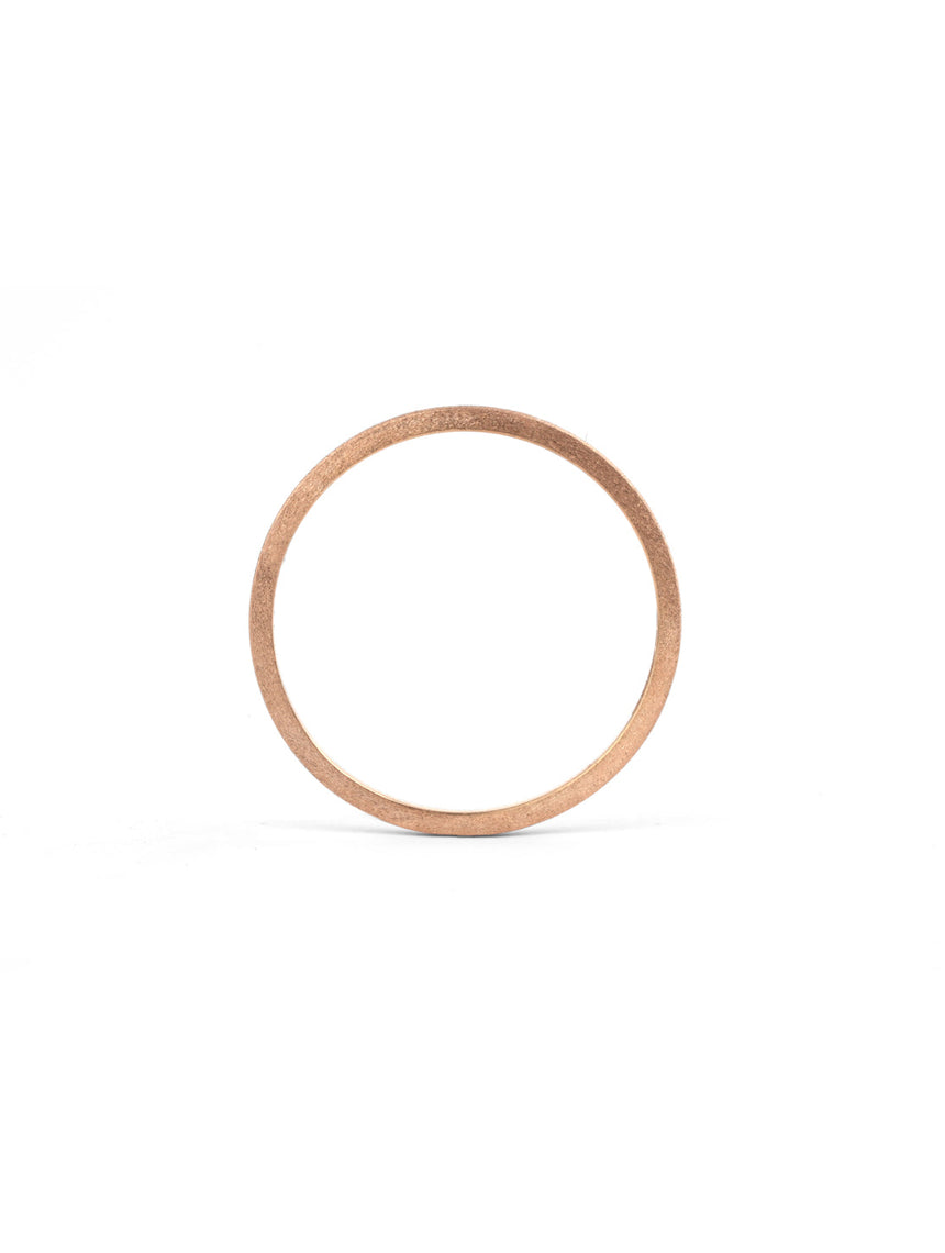 Flat wedding band. 18ct rose gold, textured finish. Side view.