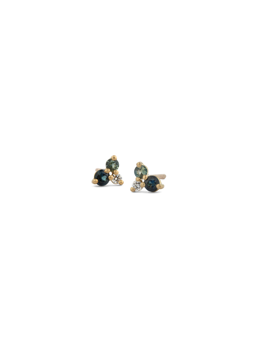 Ear studs with a cluster of three gemstones, a blue and green sapphires and white diamonds.