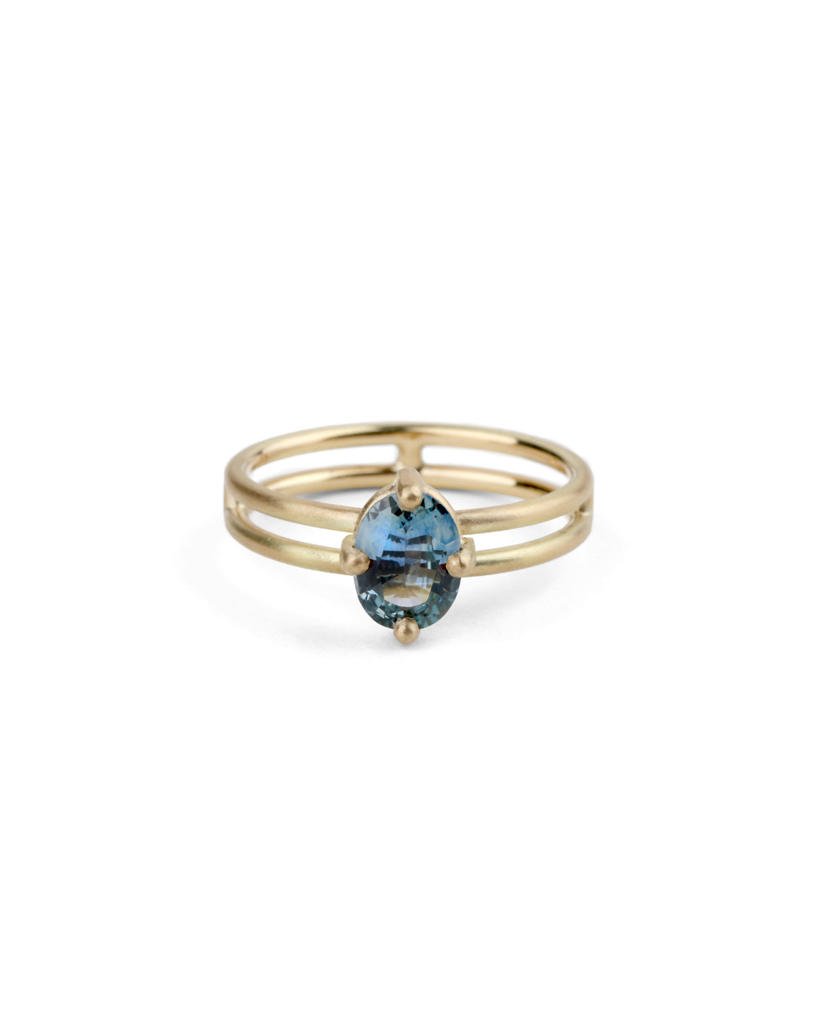 Steely blue oval sapphire ring. Four claw solitaire setting and double band, 18ct yellow gold satin finish, front view.