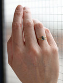 Steely blue oval sapphire ring, on hand.