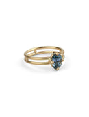 Steely blue oval sapphire ring. Four claw solitaire setting and double band, 18ct yellow gold satin finish, side view.