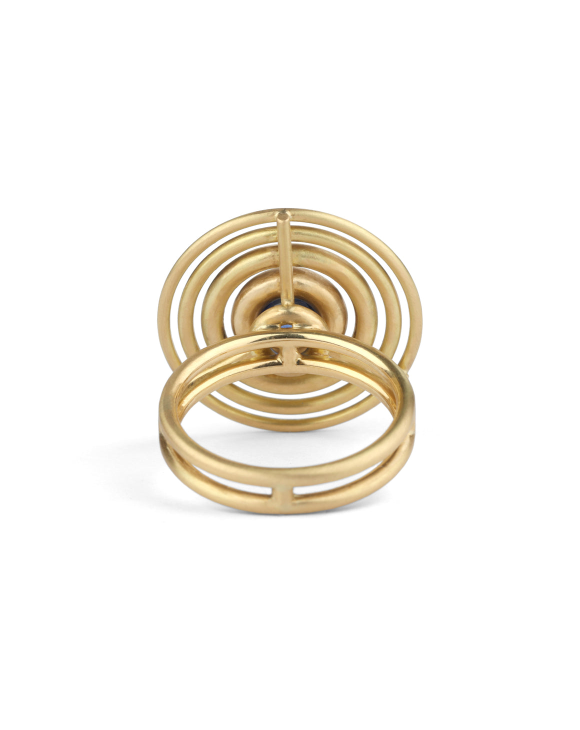 Statement ring made from concentric circles. Central blue sapphire surrounded by 18ct yellow gold rings. back view.