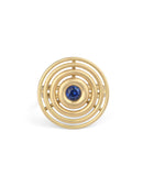 Statement ring made from concentric circles. Central blue sapphire surrounded by 18ct yellow gold rings.