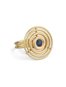 Statement ring made from concentric circles. Central blue sapphire surrounded by 18ct yellow gold rings.