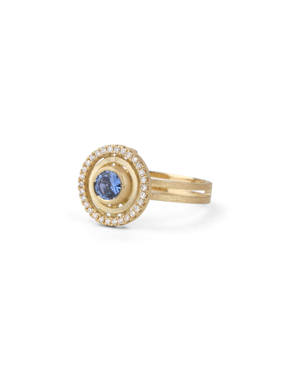 Blue sapphire ring with diamond halo detail. Textured 18ct yellow gold. Side view.