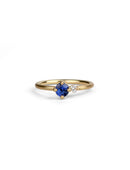 Round vivid blue sapphire ring with a round white diamond. 18ct yellow gold, satin finish.