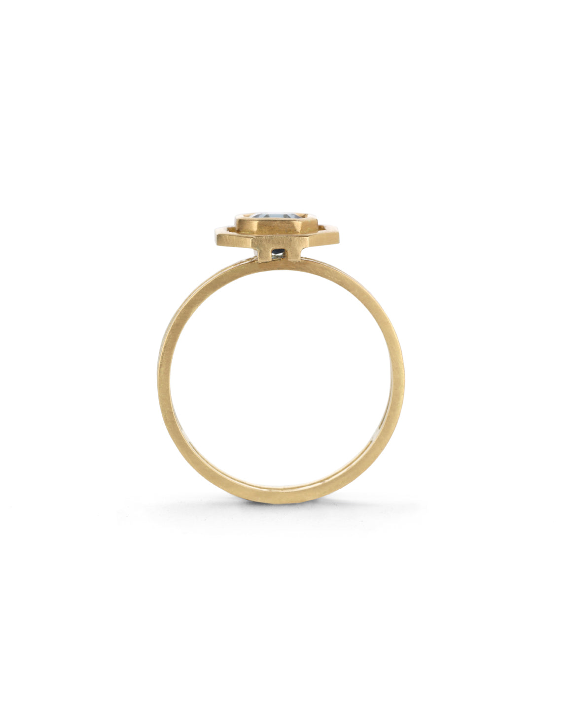 Octagon blue sapphire ring with surround detail and double band. 18ct yellow gold with satin finish. Side detail.
