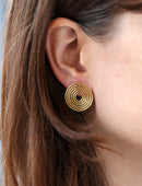 Six circle earstuds, 18ct yellow gold satin finish. In ears.