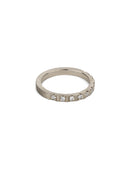 Band set with ten white diamonds. 18ct white gold with a textured finish.