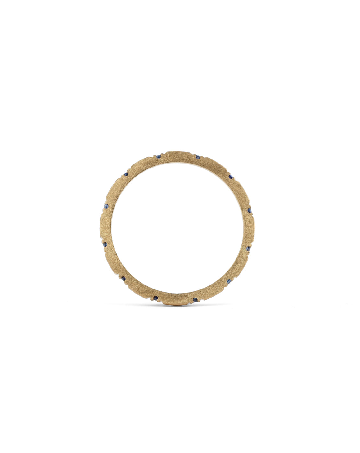 Fine gold band with set with 12 small dark blue sapphires. 18ct yellow gold textured finish. Side profile.
