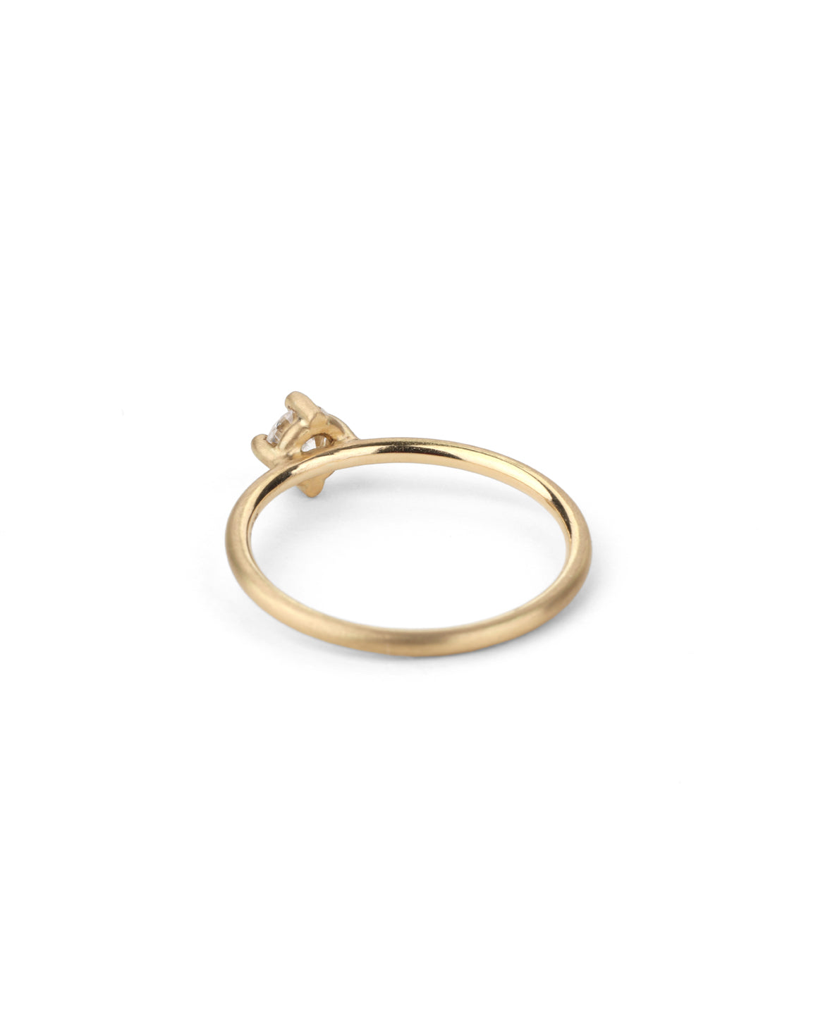 Solitaire ring with round white diamond, four claw setting. 18ct yellow gold, satin finish. Back view.
