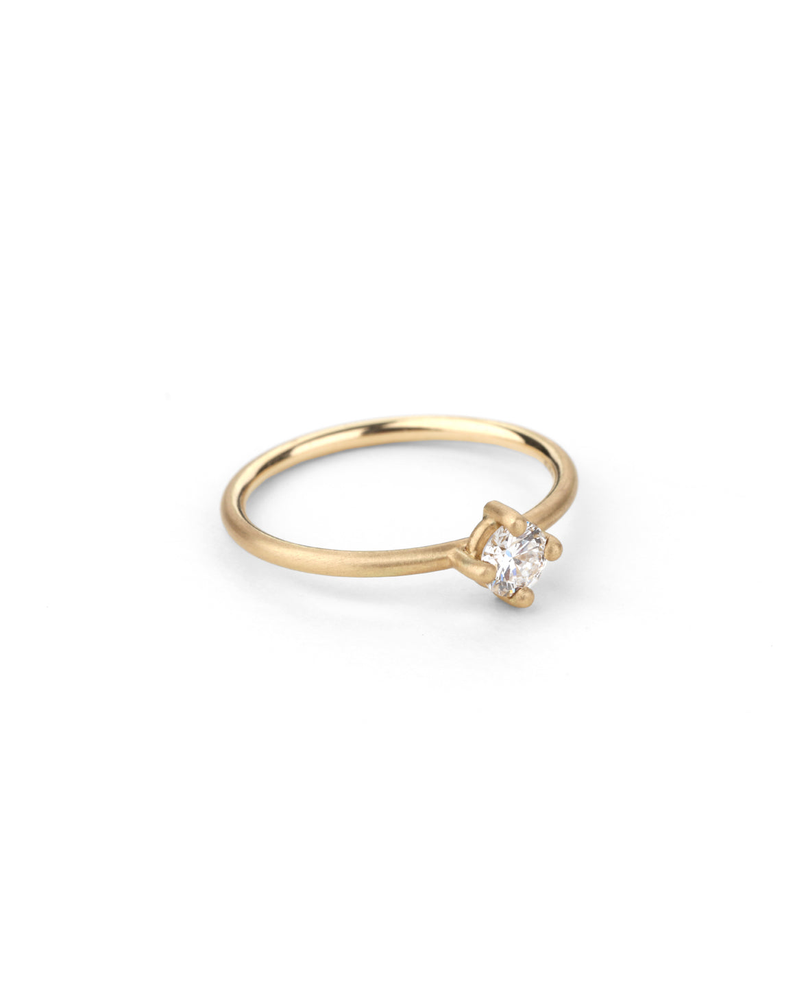 Solitaire ring with round white diamond, four claw setting. 18ct yellow gold, satin finish.