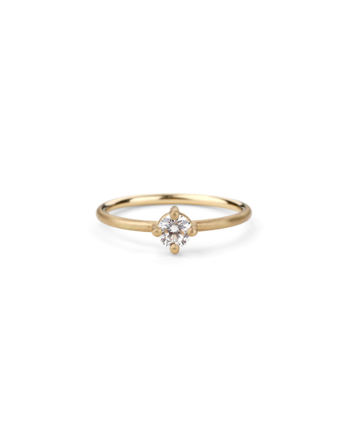 Solitaire ring with round white diamond, four claw setting. 18ct yellow gold, satin finish.