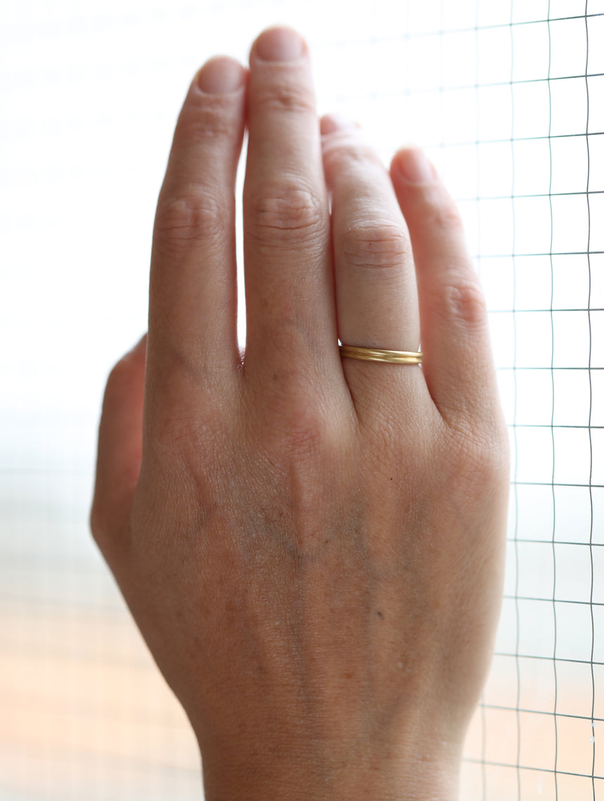 18ct yellow gold joined double band ring, satin finish. On hand.