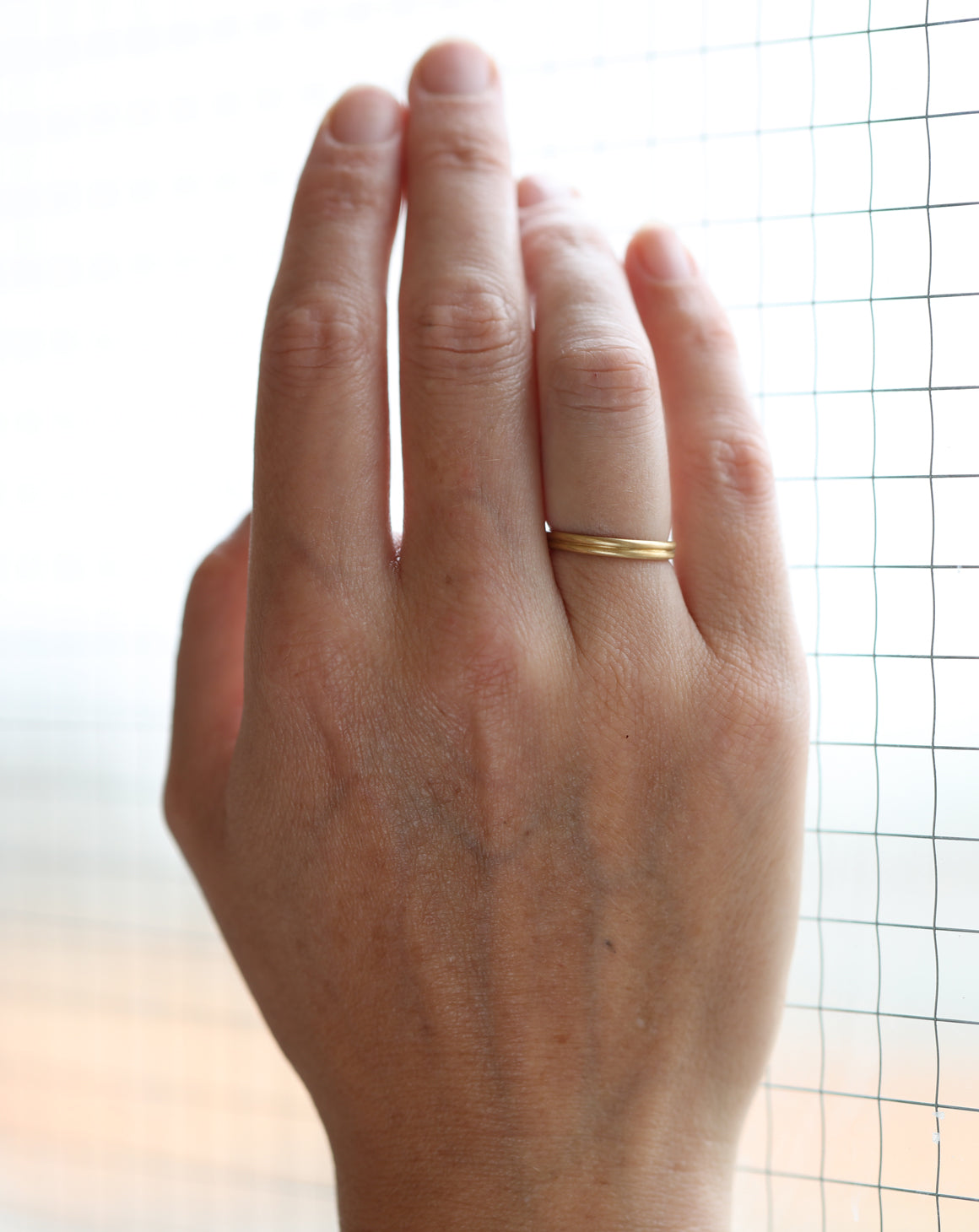 18ct yellow gold joined double band ring, satin finish. On hand.