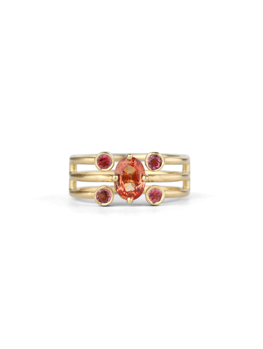 Statement three band ring with oval orange sapphire and four pink tourmalines. 18ct yellow gold, satin finish.