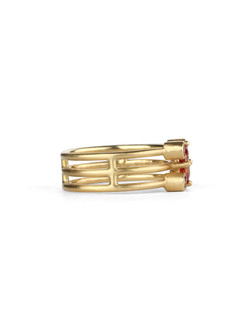 Statement three band ring with oval orange sapphire and four pink tourmalines. 18ct yellow gold, satin finish. Side view.