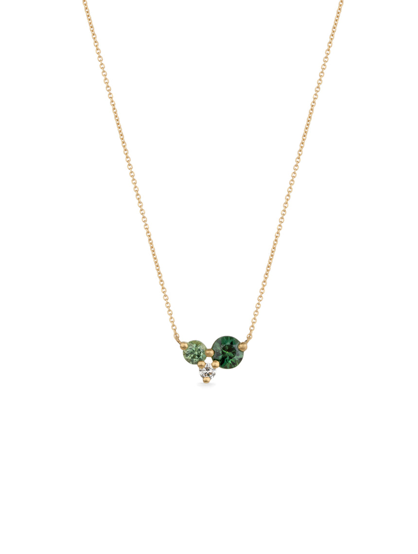 Delicate cluster pendant with two sapphires and white diamond. 