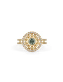 Green sapphire ring with circular detail and white diamond outer halo.  18ct yellow gold, textured finish.