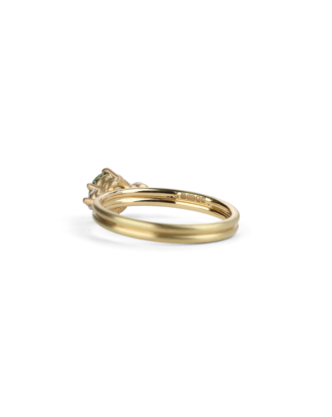 Three stone ring with green sapphire and white diamonds. Joined double band, 18ct yellow gold satin finish. Side view.