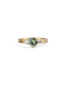 Three stone ring with green sapphire and white diamonds. Joined double band, 18ct yellow gold satin finish. 