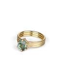 Oval green sapphire ring with six claw setting. On joined triple band, 18t yellow gold, textured finish. 