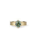 Oval green sapphire ring with six claw setting. On joined triple band, 18t yellow gold, textured finish.