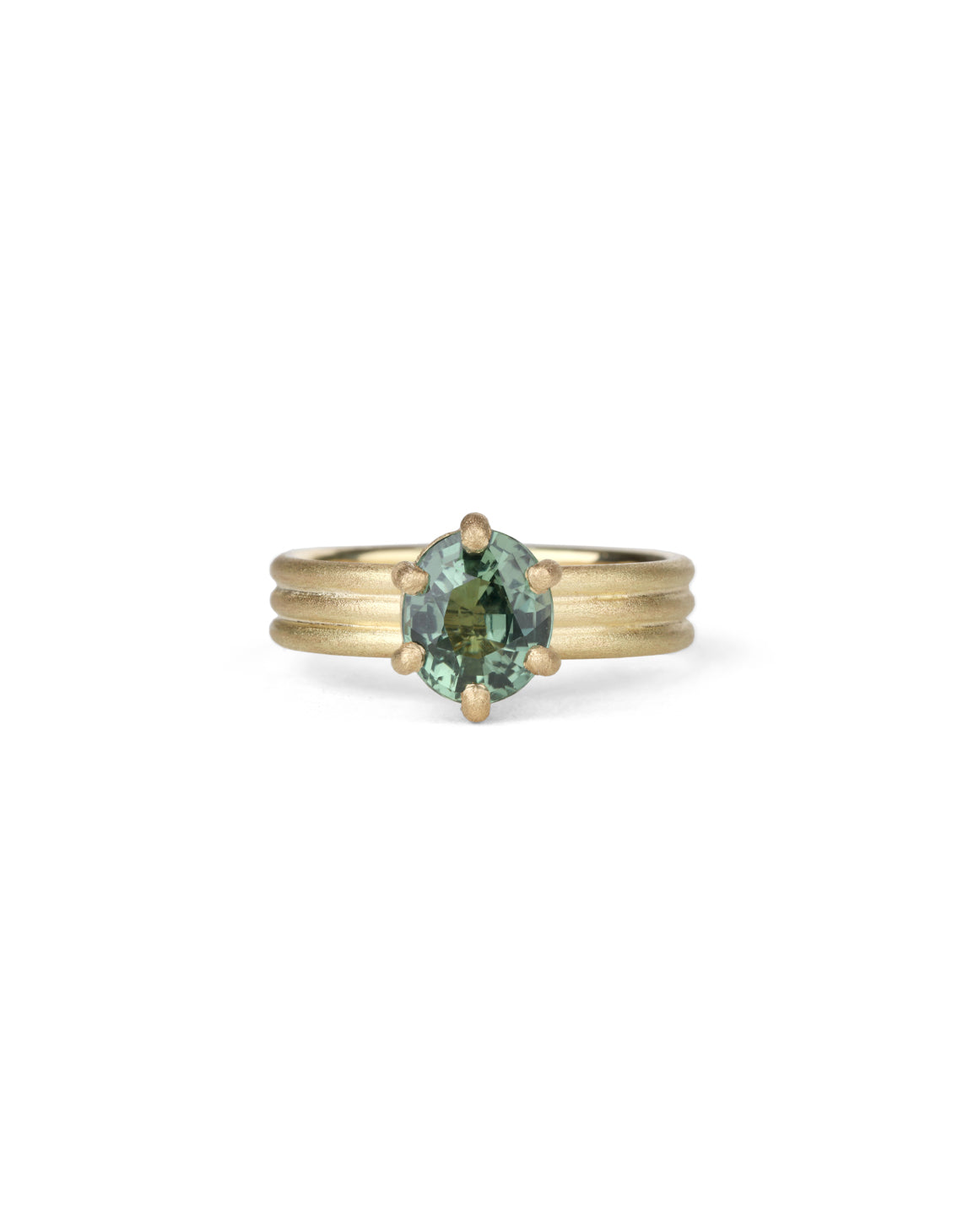 Oval green sapphire ring with six claw setting. On joined triple band, 18t yellow gold, textured finish.
