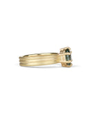Oval green sapphire ring with six claw setting. On joined triple band, 18t yellow gold, textured finish. Side view.