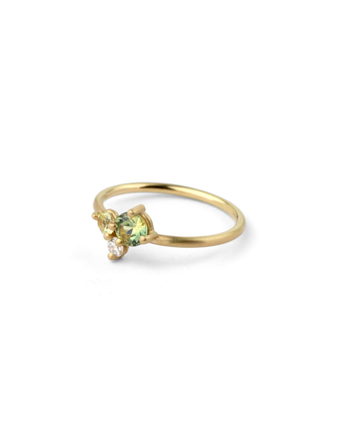 Cluster ring with green and yellow sapphire and a white diamond. 18ct yellow gold, satin finish.