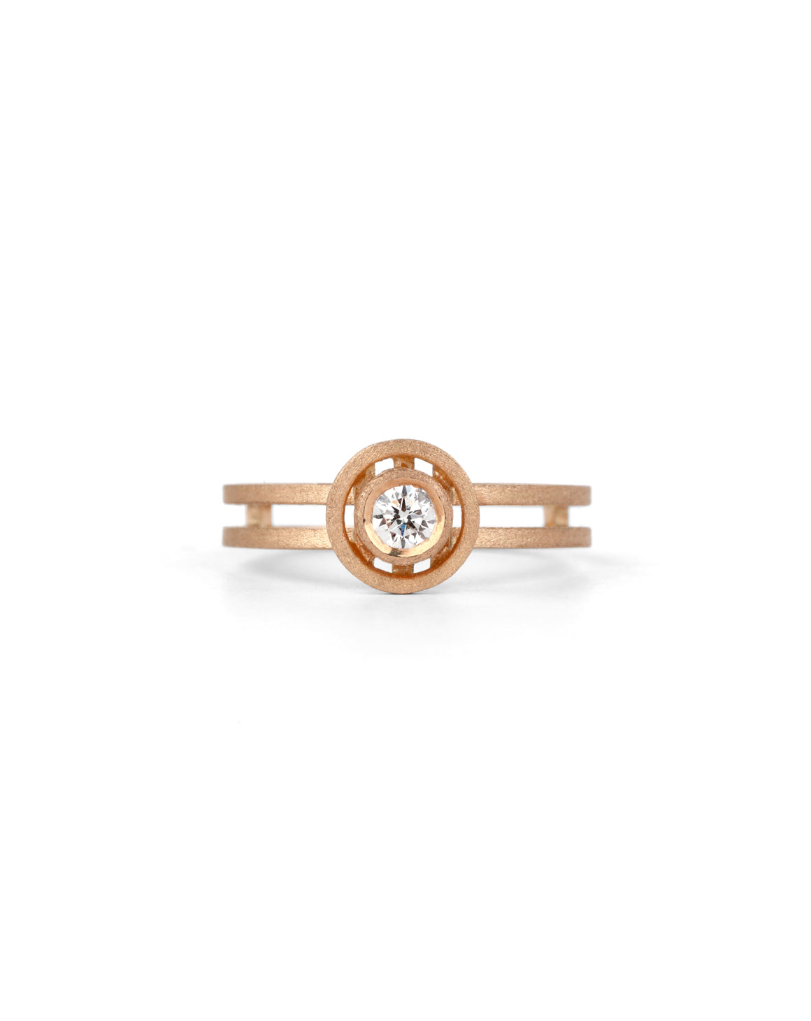 Solitaire ring with circular detail eith central diamond. 18ct rose gold, textured finish.
