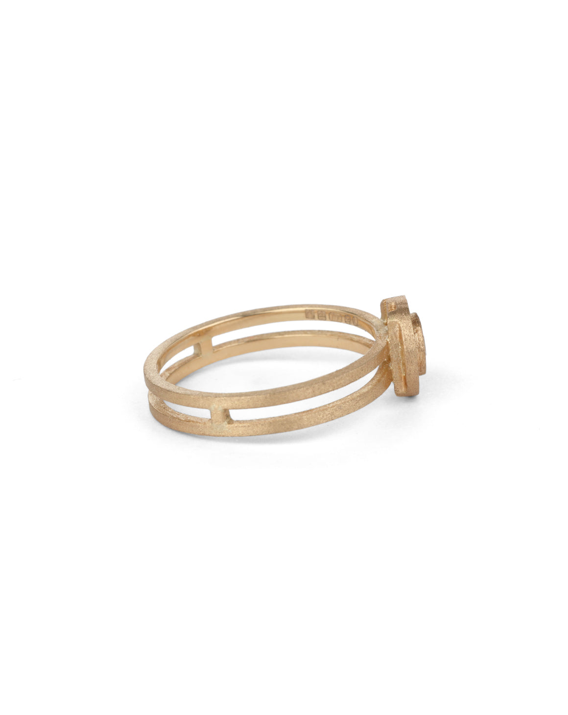 Solitaire ring with circular detail eith central diamond. 18ct rose gold, textured finish. Side view.