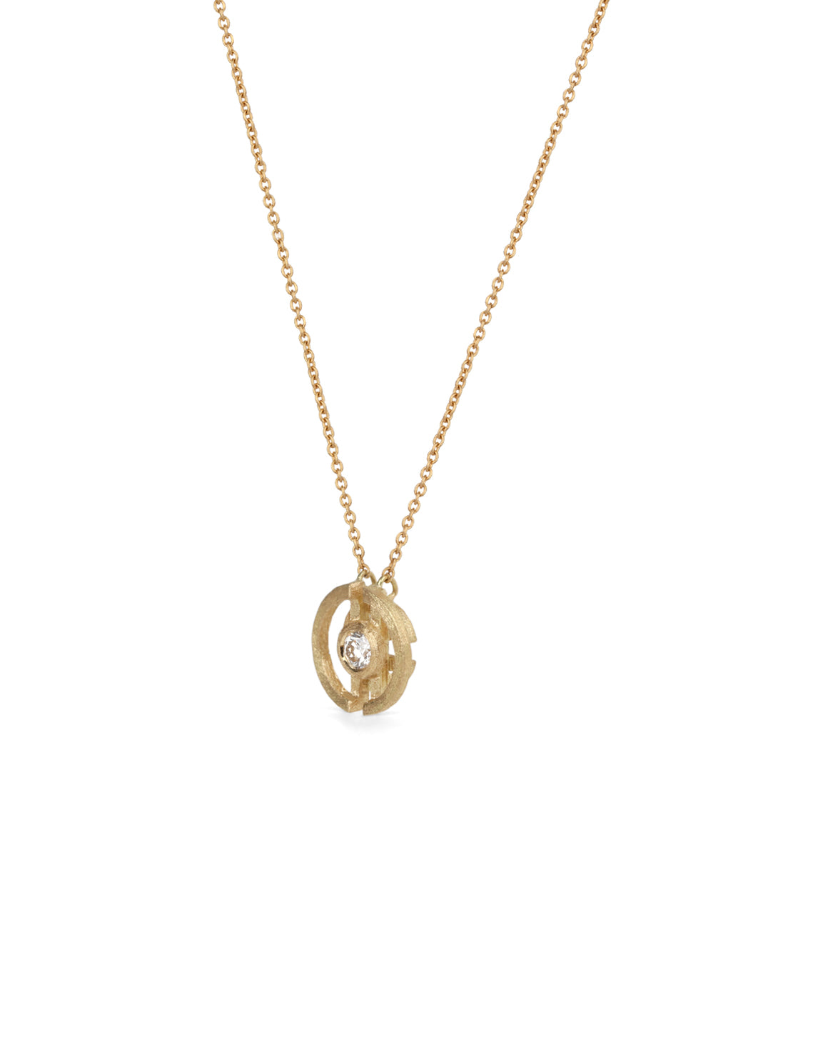 Geometric pendant with a round white diamond and semicircle detail. 18ct yellow gold, textured finish. Side detail.