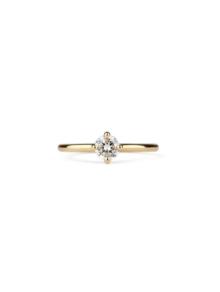 Solitaire ring with round white diamond, four claw setting. 18ct yellow gold, polished finish.