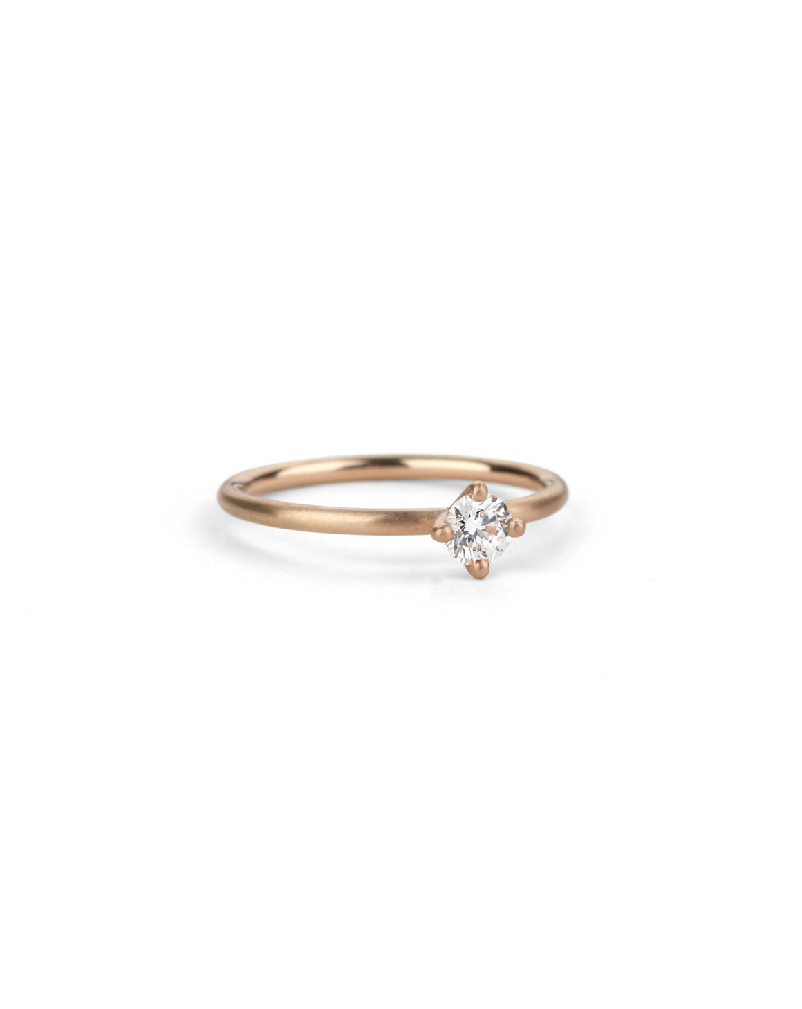 Solitaire ring with round white diamond, four claw setting. 18ct rose gold, satin finish.