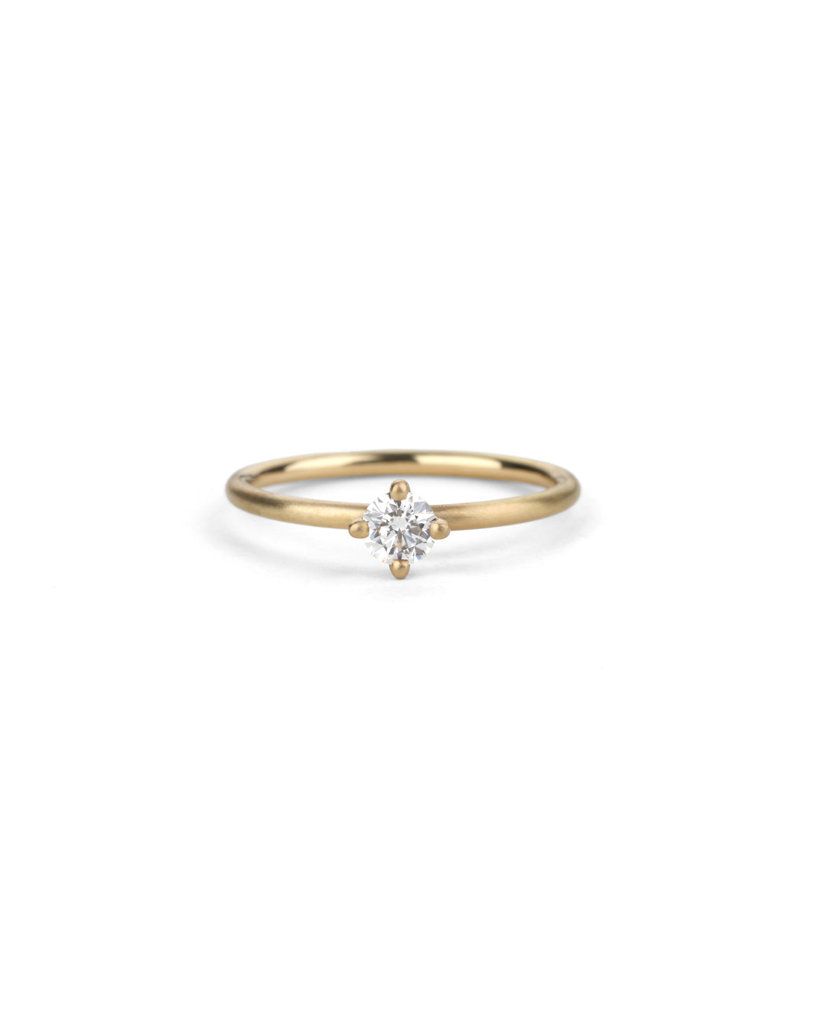 Solitaire ring with round white diamond, four claw setting. 18ct yellow gold, satin finish.