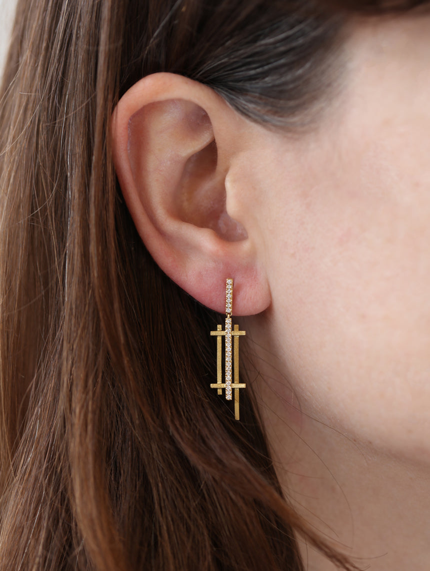 Geometric drop earrings with tiny diamond line detail. 18ct yellow gold, textured finish. Worn in ear.